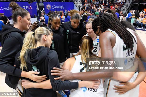 Members of the New York Liberty huddle up after winning round two game four of the 2023 WNBA Playoffs against the Connecticut Sun on October 1, 2023...