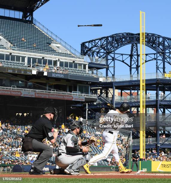 Jared Triolo of the Pittsburgh Pirates loses his bat on a swing in the second inning against the Miami Marlins at PNC Park on October 1, 2023 in...