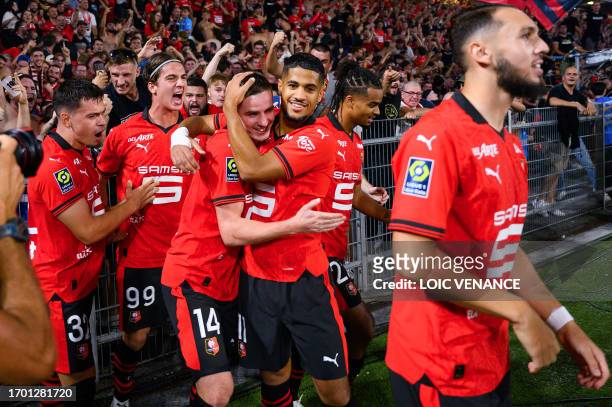 Rennes' French midfielder Benjamin Bourigeaud celebrates after scoring the first goal for his team during the French L1 football match between Stade...