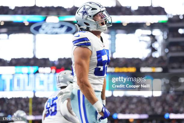 Leighton Vander Esch of the Dallas Cowboys celebrates after scoring a touchdown against the New England Patriots during the first half at AT&T...