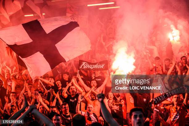 Rennes' supporters wave flairs during the French L1 football match between Stade Rennais FC and FC Nantes at The Roazhon Park Stadium in Rennes,...
