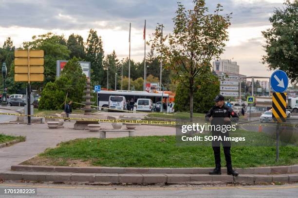 Police officer stands on guard in front of the Ministry of Internal Affairs, where the bomb attack took place. At around 9 a.m. In Turkey's capital...