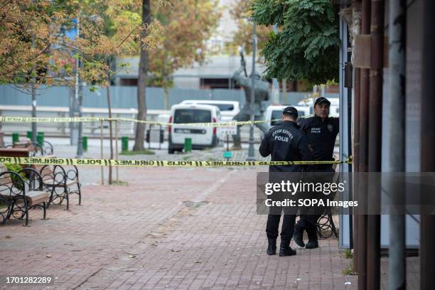 Two police officers stand on guard in front of the Ministry of Internal Affairs, where the bomb attack took place. At around 9 a.m. In Turkey's...