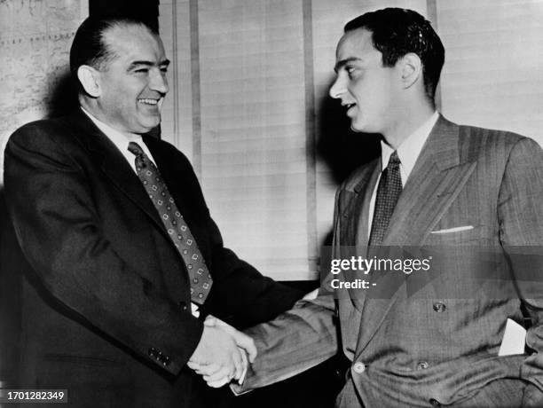 Senator of Wisconsin Joseph McCarthy shakes hands with his adviser Roy Cohn , on May 15, 1954 in Washington DC. Joseph McCarthy achieved fame for his...