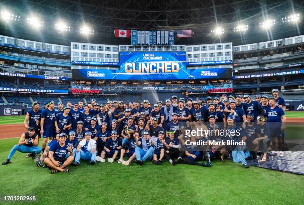 Toronto Blue jays pose for a team picture after the game against the Tampa Bay Rays, to celebrate clinching a playoff spot the day before, after...