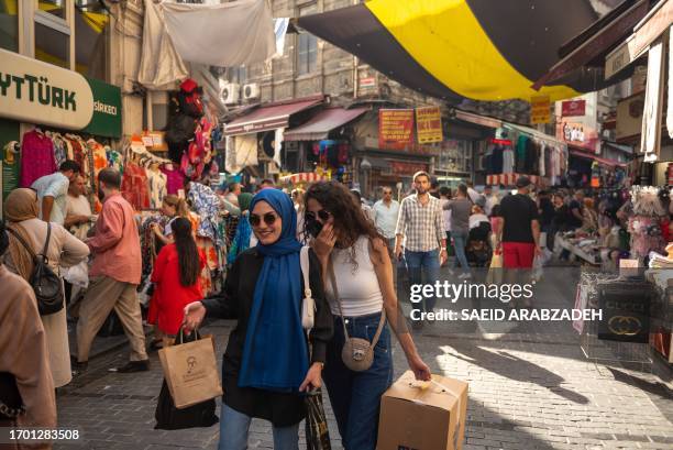 Istanbul, Turkey. People cross through the old bazaar in the Fateh district of Istanbul.