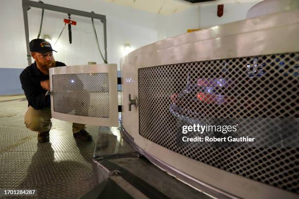 Cambridge, Idaho, Thursday, April 27, 2023 - - Neil Lincoln, operator of Brownlee Dam for Idaho Power, shines a flashlight on the inner workings of a...