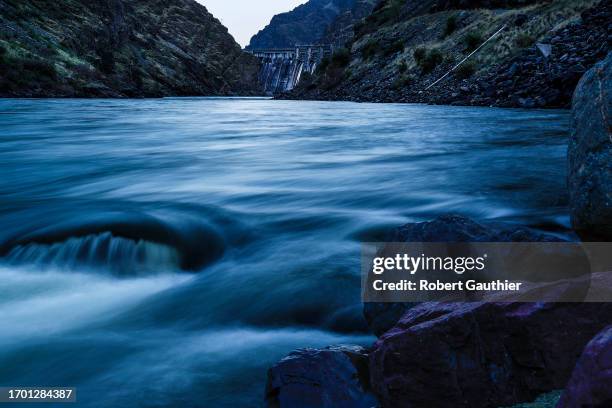 Hells Canyon,Oregon, Wednesday, April 26, 2023-- The Snake River rushes through Hell's Canyon Dam as night falls.