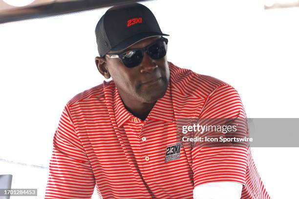 23Xi co-owner Michael Jordan sits on the pit box and watches the action prior to the running of the NASCAR Cup Series Playoff YellaWood 500 on...