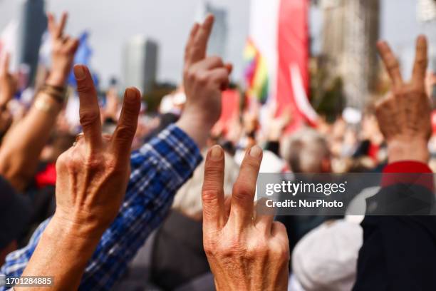 People show v-signs during 'Million Hearts March' organized by Civic Coalition in Warsaw, Poland on October 1st, 2023. The largest demonstration in...