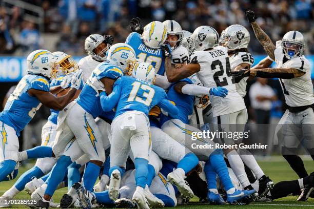 Inglewood, CA, Sunday, October 1, 2023 - Los Angeles Chargers quarterback Justin Herbert is stopped for no gain on a 4th and inches play late in the...