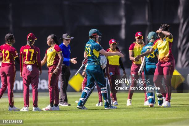 Australia and West Indies players shake hands at the conclusion of the first match of the Women's T20 International Series between Australia and West...