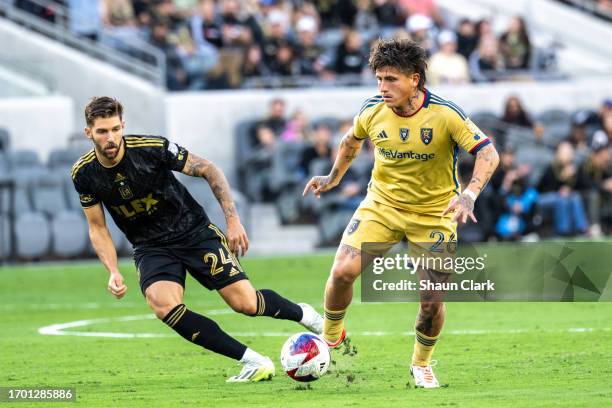 Diego Luna of Real Salt Lake battles Ryan Hollingshead of Los Angeles FC during the match at BMO Stadium on October 1, 2023 in Los Angeles,...