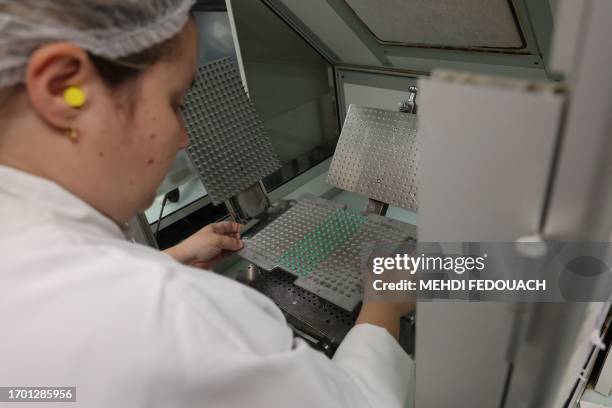 Pharmacy technician prepares medecines in the laboratory of the Delpech pharmacy in Paris, on September 28, 2023. Amoxicillin, corticoids and now...
