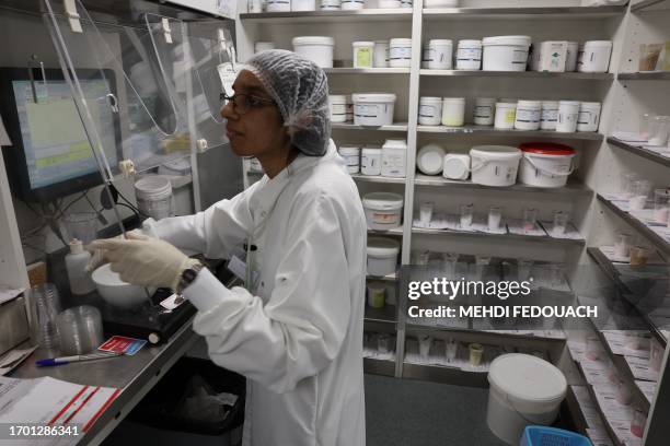 Pharmacy technician prepares medecines in the laboratory of the Delpech pharmacy in Paris, on September 28, 2023. Amoxicillin, corticoids and now...