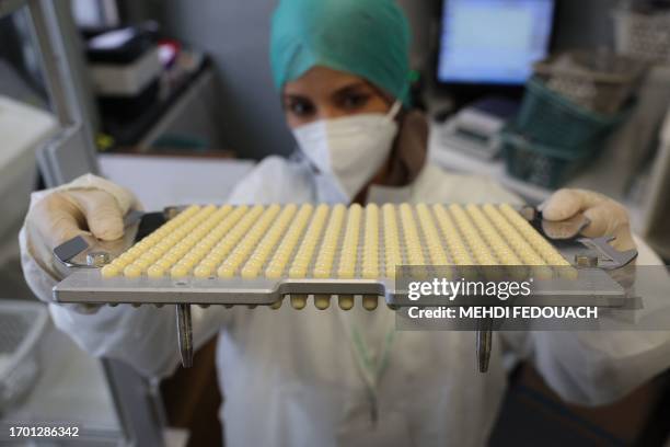 Rachida, a pharmacy technician, prepares medecines in the laboratory of the Delpech pharmacy in Paris, on September 28, 2023. Amoxicillin, corticoids...