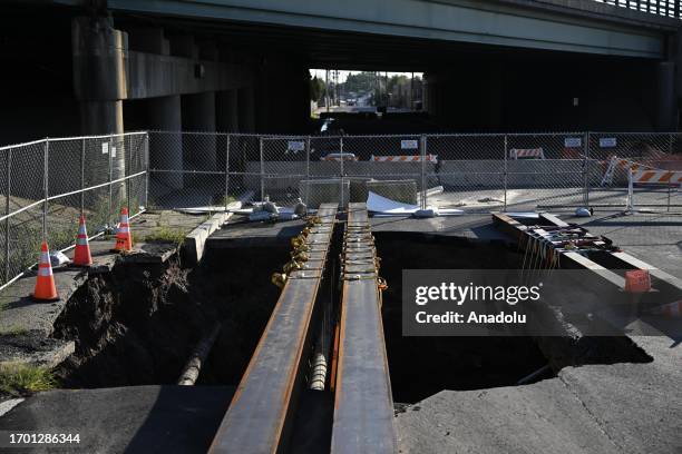 Floodwaters build up in a sinkhole after the storm, on Ramsey Avenue in Hillside, New Jersey, United States on October 01, 2023.