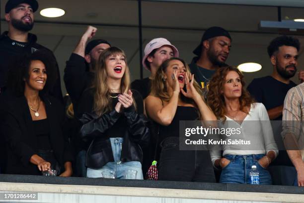 Taylor Swift and Blake Lively cheer from the stands during an NFL football game between the New York Jets and the Kansas City Chiefs at MetLife...