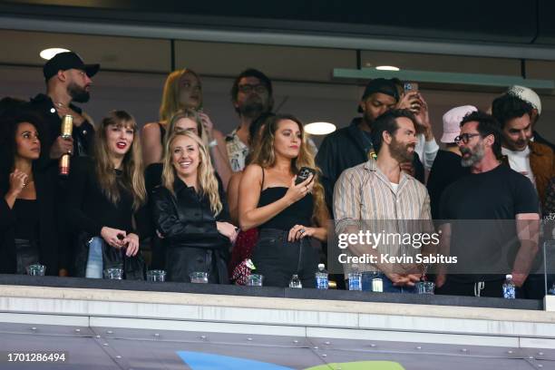 Taylor Swift, Brittany Mahomes, Blake Lively, Hugh Jackman, and Ryan Reynolds watch from the stands during an NFL football game between the New York...