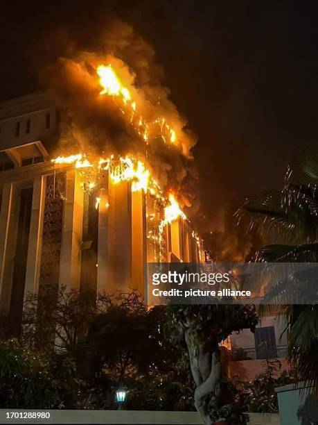 October 2023, Egypt, Ismailia: Fire and smoke rise from the burning building of the police headquarters in Ismailia. At least 38 people were injured...