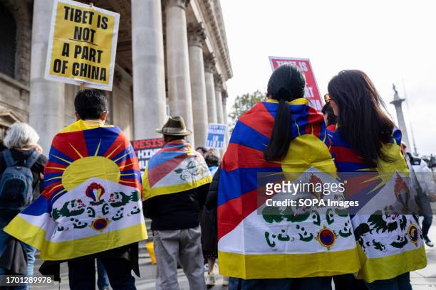 Young Tibetans are seen wrapped in their national flags, also known as the "Snow Lion flag", during the joint rally. Hongkongers, Southern Mongolian,...