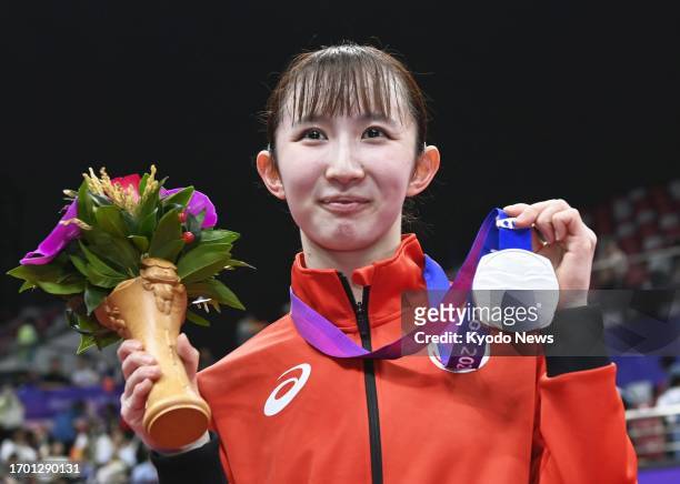 Japan's Hina Hayata poses with the silver medal she won in the women's table tennis singles event at the Asian Games in Hangzhou, China, on Oct. 1,...
