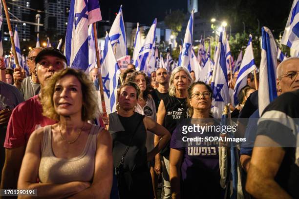 Protesters listen to a speech during a demonstration against the judicial reform. The government of Benjamin Netanyahu has pushed through a series of...