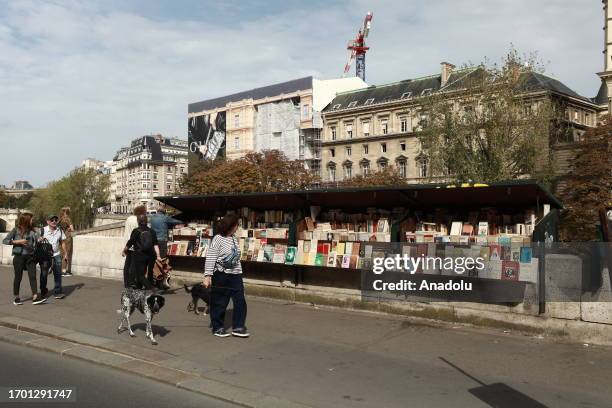 View of a bookstore as the 2024 Olympic Games in Paris starts being a threat to the bibliopole near the Seine river which has been selling books for...