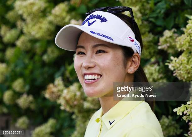 Yuna Nishimura of Japan speaks to reporters after finishing in a tie for third place at the NW Arkansas Championship golf tournament at Pinnacle...