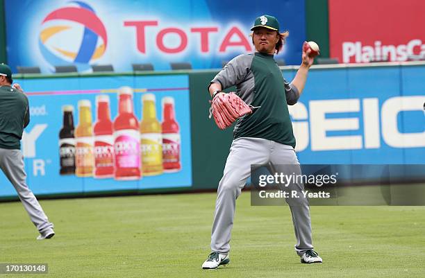 Hideki Okajima of the Oakland Athletics during batting practice before the game against the Texas Rangers at Rangers Ballpark on May 22, 2013 in...