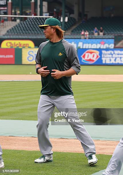 Hideki Okajima of the Oakland Athletics during batting practice before the game against the Texas Rangers at Rangers Ballpark on May 22, 2013 in...