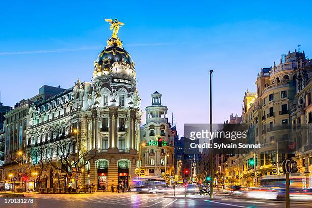 madrid, metropolis building at night - madrid stock pictures, royalty-free photos & images