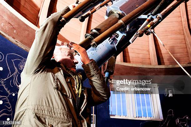 astronomer in an observatory - observatorium stockfoto's en -beelden