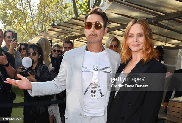 Robert Downey Jr. And Stella McCartney attend the Stella McCartney show during Paris Fashion Week Womenswear Spring/Summer 2024 on October 2, 2023 in...