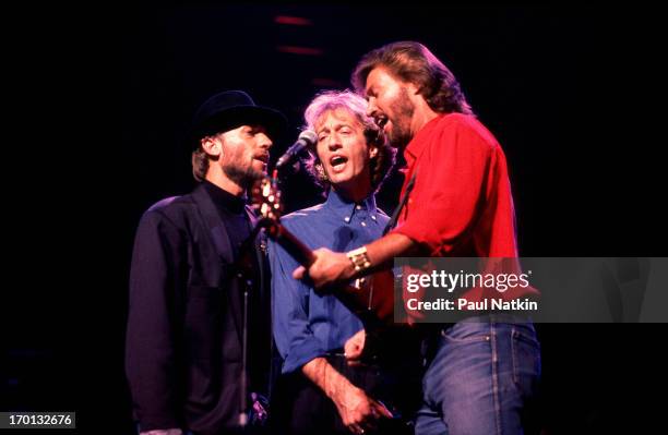 British pop group the Bee Gees perform onstage at the Poplar Creek Music Theater, Hoffman Estates, Illinois, July 31, 1989. Pictured are, from left,...