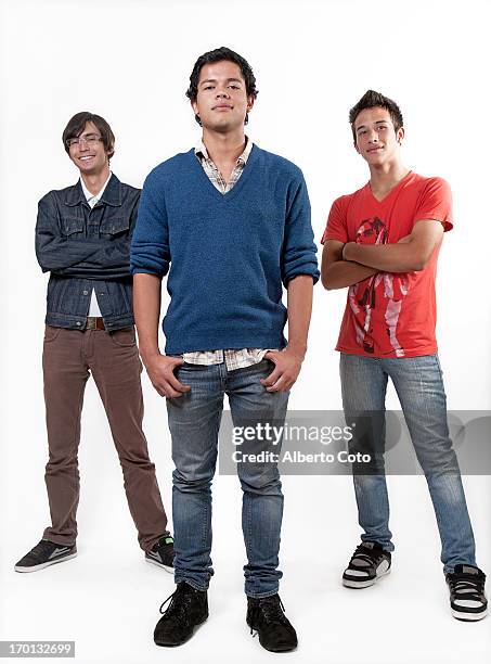 full body studio portrait of three young men - man standing full body stock-fotos und bilder