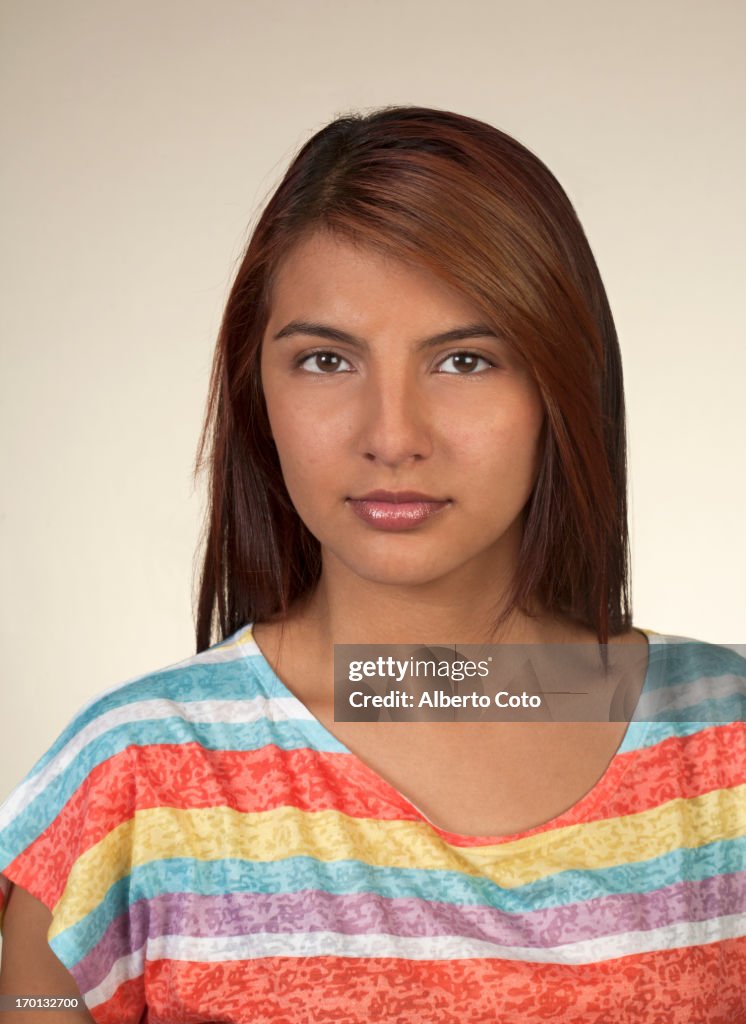 Studio portrait of hispanic young girl