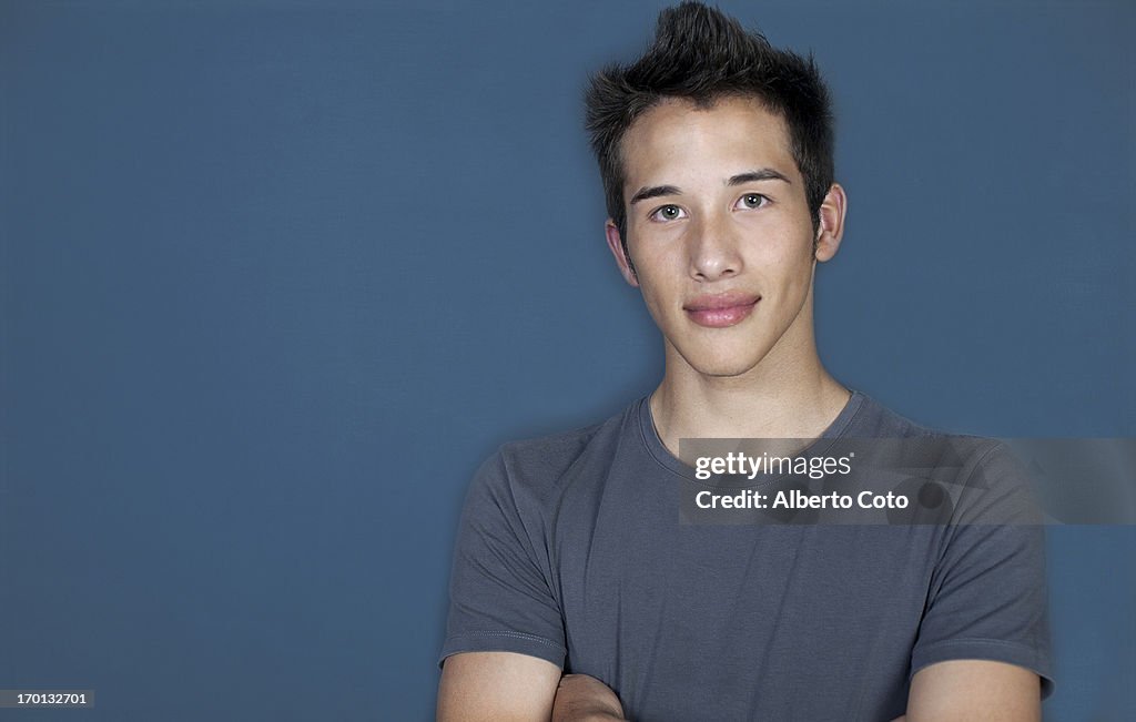 Hispanic teenage boy studio portrait