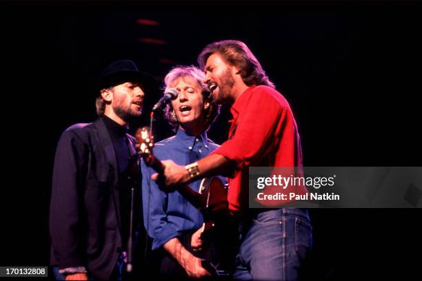 British pop group the Bee Gees perform onstage at the Poplar Creek Music Theater, Hoffman Estates, Illinois, July 31, 1989. Pictured are, from left,...