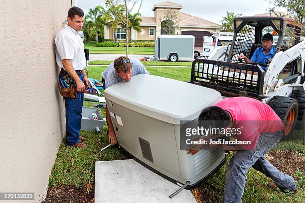 installing an whole house emergency generator for hurricane season - hurricane preparation stock pictures, royalty-free photos & images