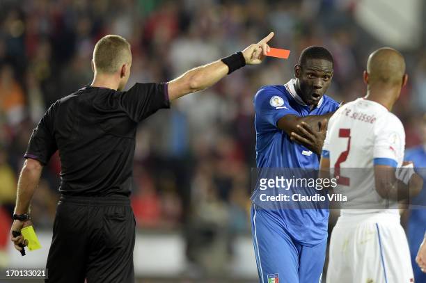 Mario Balotelli of Italy is shown a red card by referee Svein Oddvar Moen during the FIFA 2014 World Cup Qualifier group B match between Czech...