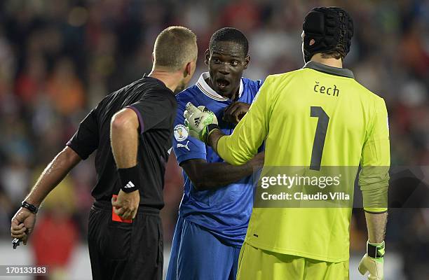 Referee Svein Oddvar Moen issues a red card to Mario Balotelli of Italy during the FIFA 2014 World Cup Qualifier group B match between Czech Republic...