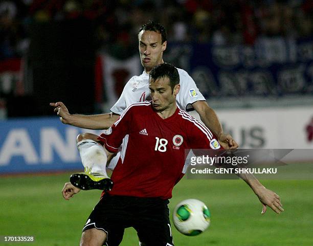 Albanias Hamdi Salihi vies for the ball with Norway's Tore Reginiussen during the FIFA 2014 World Cup qualifying football match between Albania and...