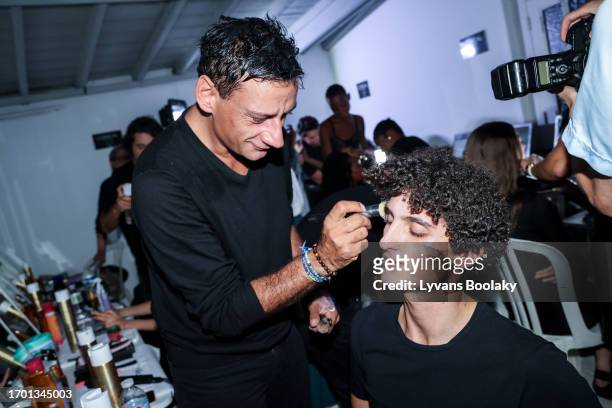 Claverie Benoit and a model prepare backstage prior to the Mossi Womenswear Spring/Summer 2024 show as part of Paris Fashion Week on September 25,...
