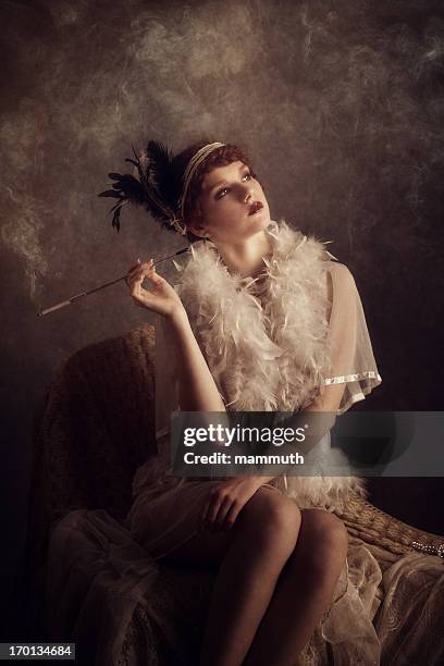 retro woman smoking cigarette - boa stock pictures, royalty-free photos & images