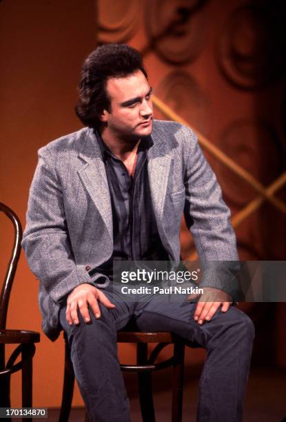 American comedian Jim Belushi performs onstage during the Second City 25th Anniversary show at the Vic Theater, Chicago, Illinois, December 16, 1984.