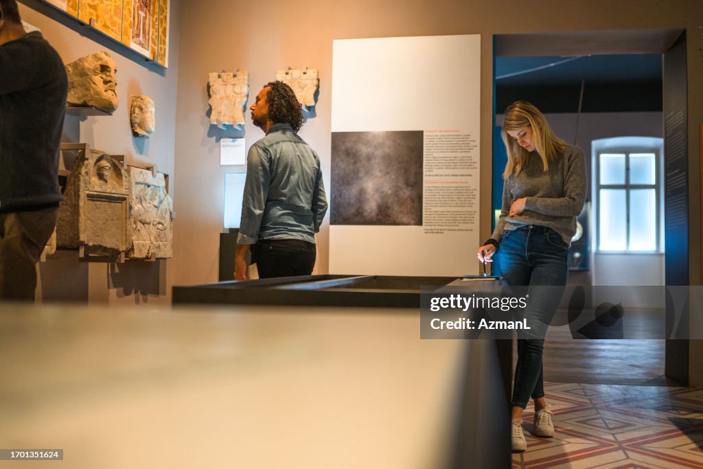 Couple of Tourists Visiting a City Museum