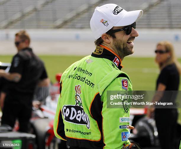 James Hinchcliffe, in the GoDaddy.com Chevrolet, enjoys a laugh before his IndyCar qualifying run for the Firestone 550 at Texas Motor Speedway in...