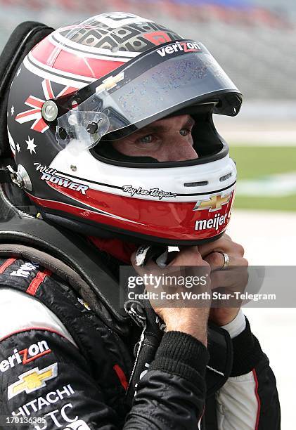 Verizon Team Penske driver Will Power removes his helmet after qualifying for the IZOD IndyCar Series Firestone 550 at Texas Motor Speedway in Fort...