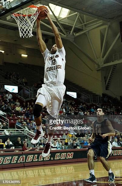 Forward Ryan Anderson gets a breakaway dunk off an assist by freshman guard Olivier Hanlan in the 1st half. Boston College men's basketball plays...